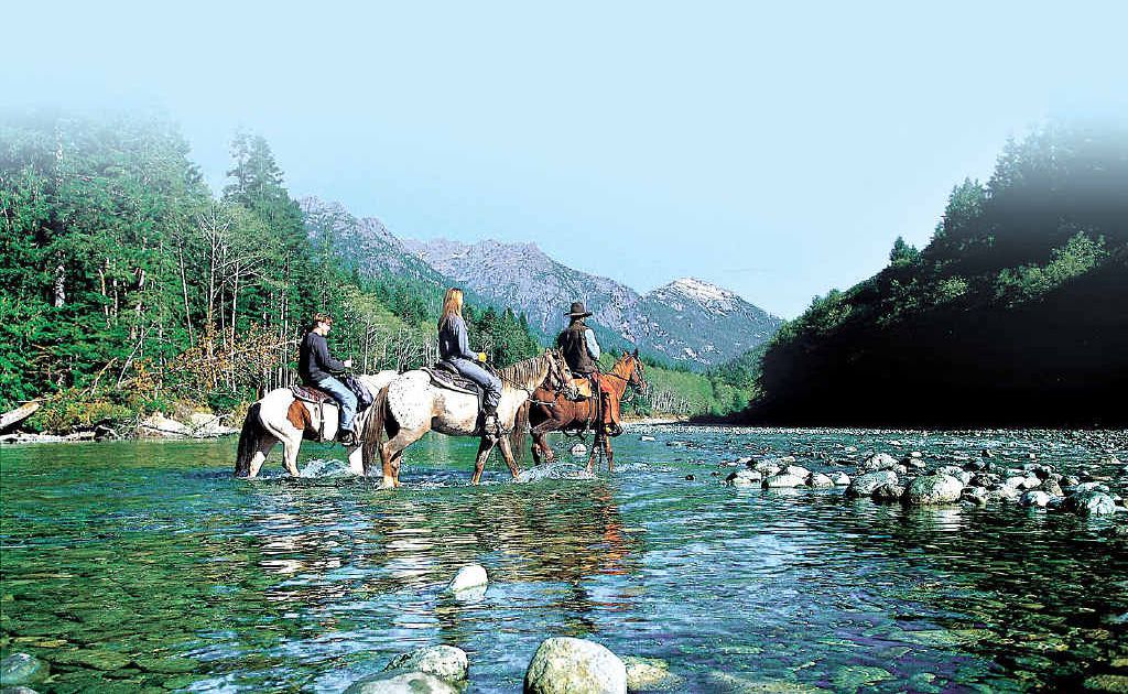 BEAR COUNTRY: John “Cowboy” Caton leads guests off on a trek. BEAR COUNTRY: John “Cowboy” Caton leads guests off on a trek.